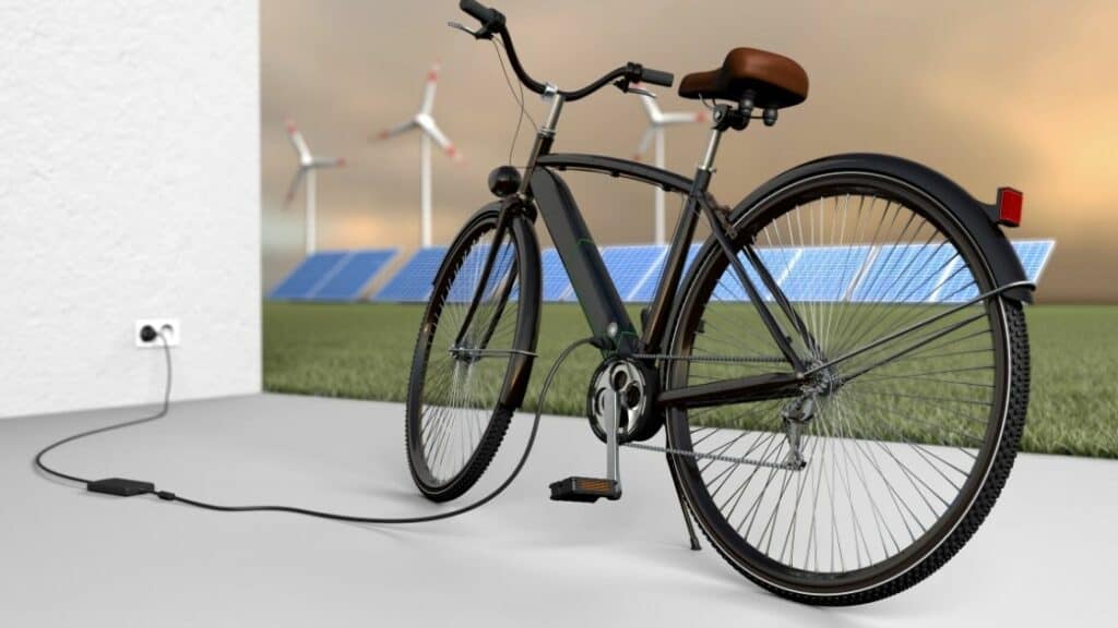 Photo of an electric bike being charge from a wall