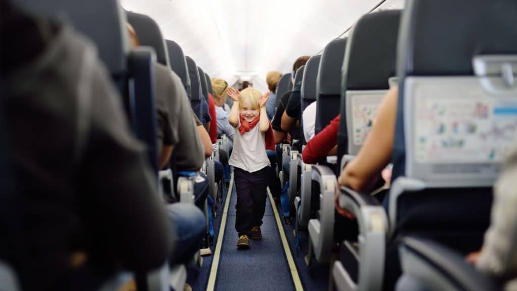 The Best Seats to Book When Flying With Children 5 flying with children - child on a plane