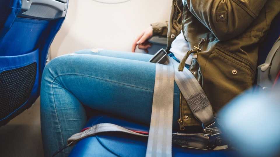 How to sleep on a plane - fasten your seatbelt